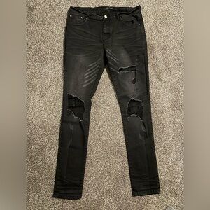 AMIRI Black Distressed Skinny Jeans